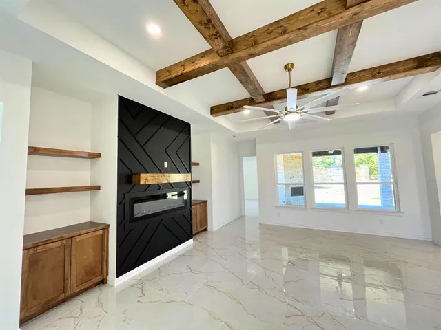 a kitchen with a refrigerator and a stove