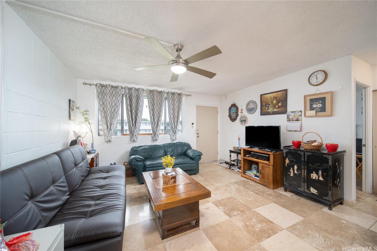 a living room with furniture and a flat screen tv