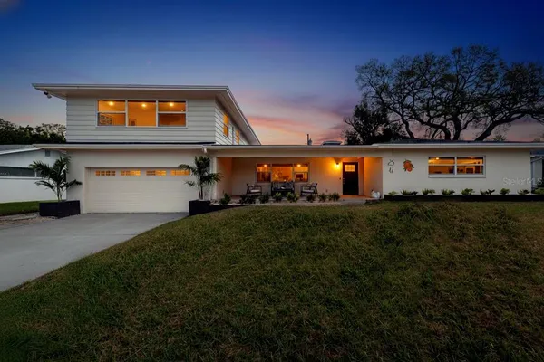 a front view of house with garden