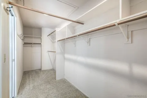 a bathroom with a sink a large mirror and a bathtub