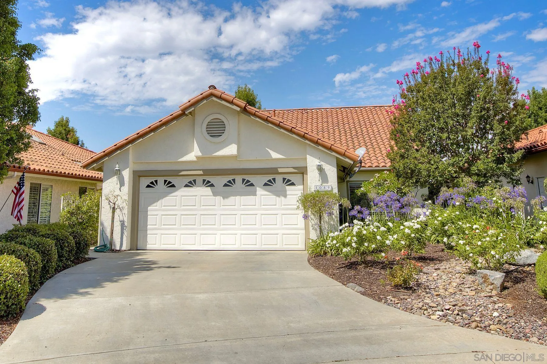 1089 Ridge Heights Drive Fallbrook, CA 92028 - Photo 2 of 42 a front view of a house with a garden and plants