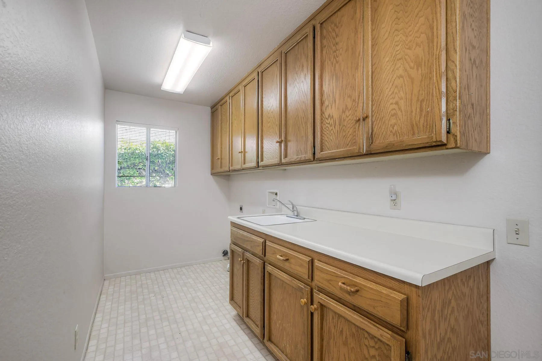 1089 Ridge Heights Drive Fallbrook, CA 92028 - Photo 24 of 42 a kitchen with a sink cabinets and window
