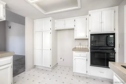 a kitchen with a sink stove and refrigerator