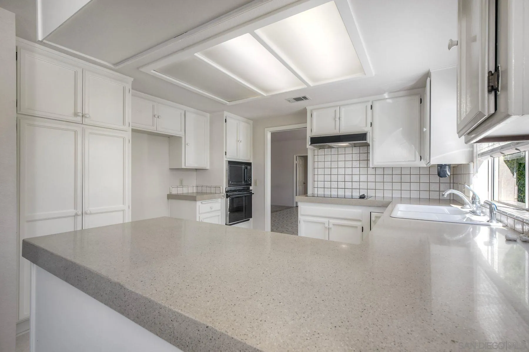 1089 Ridge Heights Drive Fallbrook, CA 92028 - Photo 9 of 42 a kitchen with refrigerator and cabinets