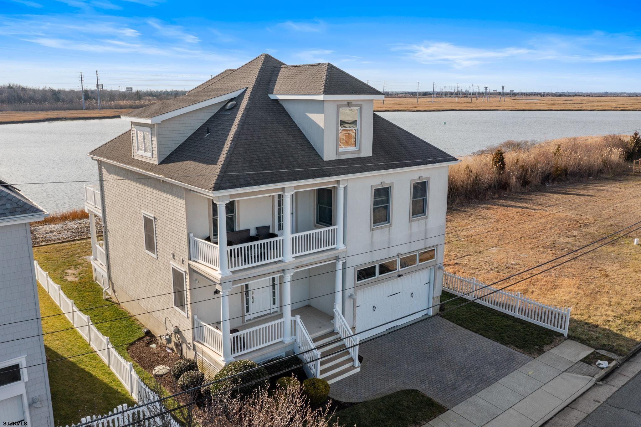 a aerial view of a house with a ocean view