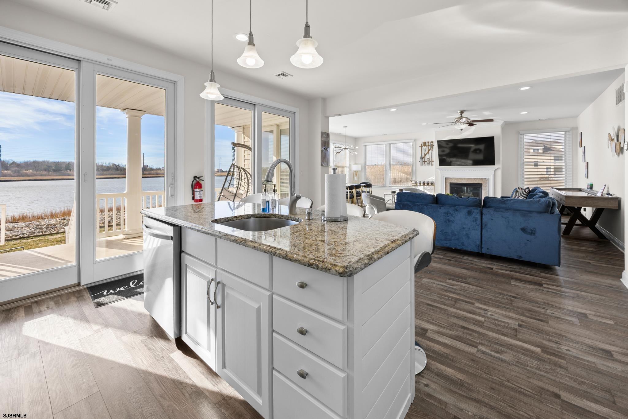 2010 West Riverside Drive Atlantic City, NJ 08401 - Photo 12 of 58 a living room with granite countertop furniture a flat screen tv and a large window