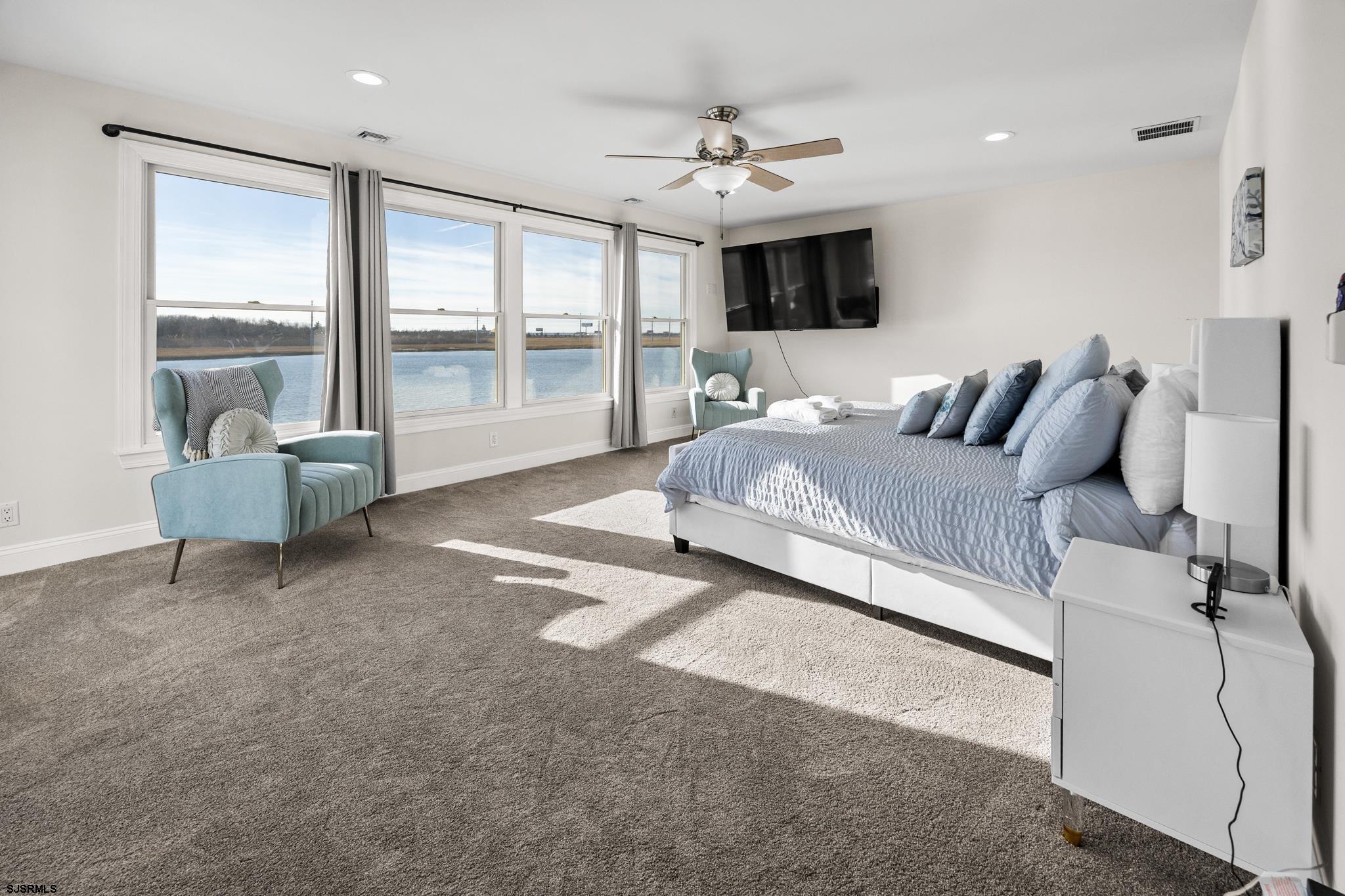 2010 West Riverside Drive Atlantic City, NJ 08401 - Photo 19 of 58 a spacious bedroom with a large bed and a window