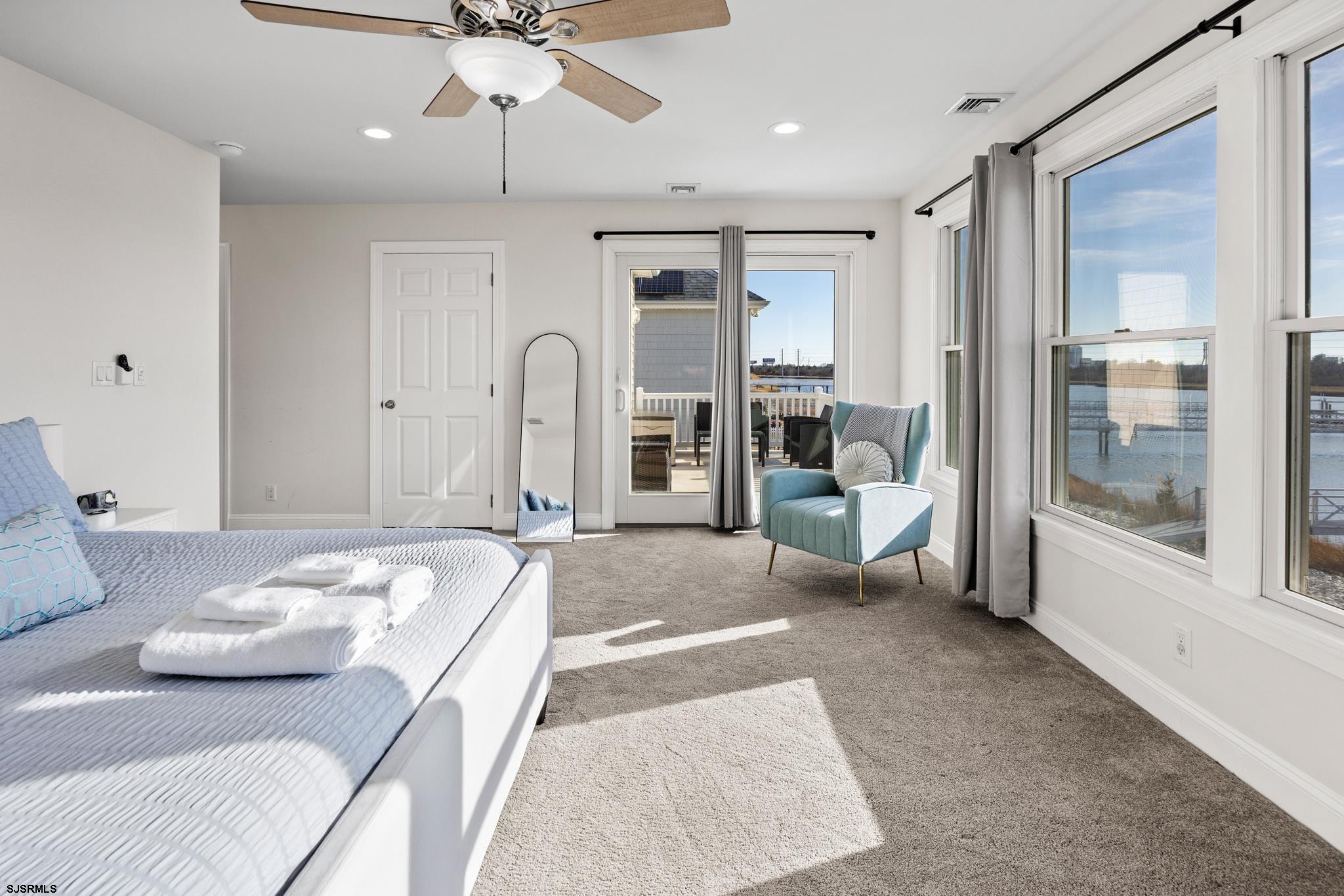 2010 West Riverside Drive Atlantic City, NJ 08401 - Photo 20 of 58 a spacious bedroom with a bed a table and chairs