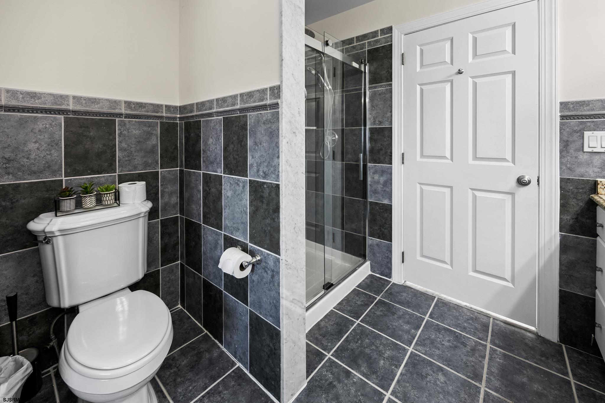 2010 West Riverside Drive Atlantic City, NJ 08401 - Photo 25 of 58 a bathroom with a toilet and a shower