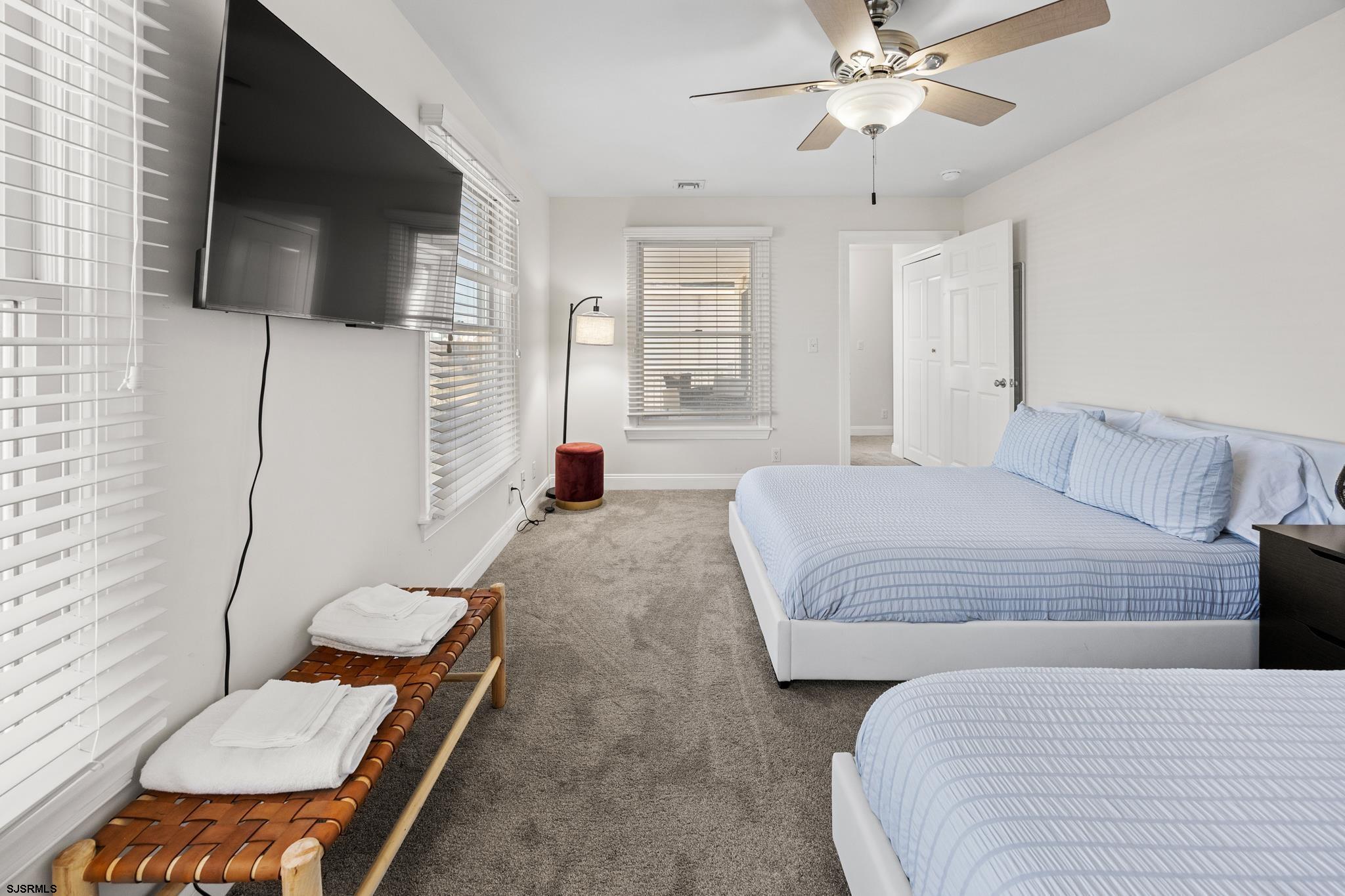 2010 West Riverside Drive Atlantic City, NJ 08401 - Photo 31 of 58 a spacious bedroom with a bed and a flat screen tv