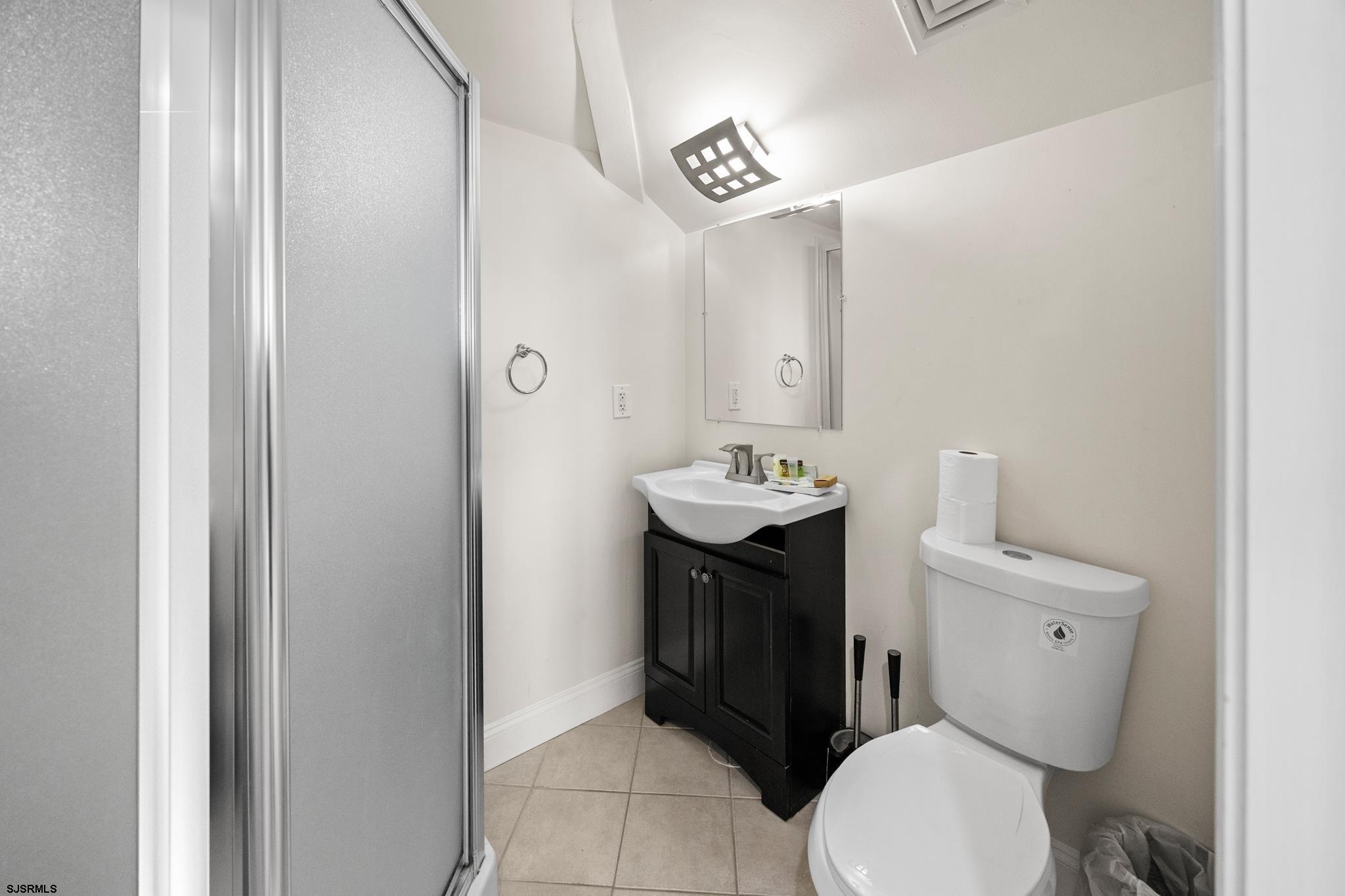 2010 West Riverside Drive Atlantic City, NJ 08401 - Photo 38 of 58 a bathroom with a toilet sink and mirror