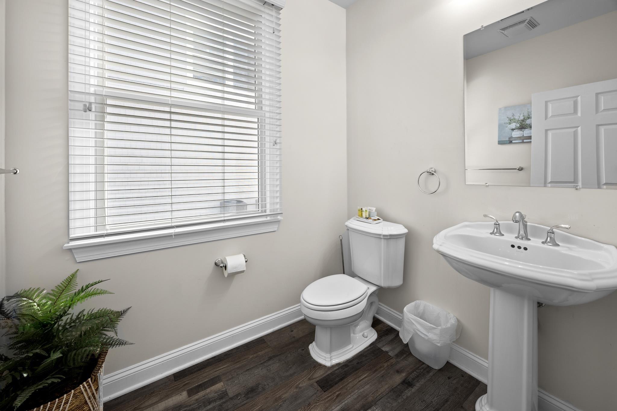 2010 West Riverside Drive Atlantic City, NJ 08401 - Photo 6 of 58 a bathroom with a sink toilet and a window
