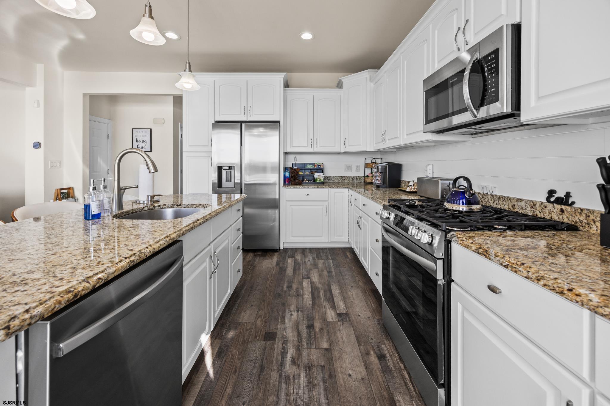 2010 West Riverside Drive Atlantic City, NJ 08401 - Photo 10 of 58 a kitchen with stainless steel appliances granite countertop a sink stove and cabinets