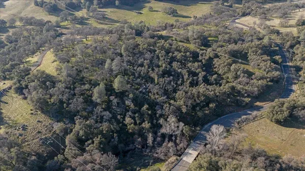 a view of a town with mountains in the background