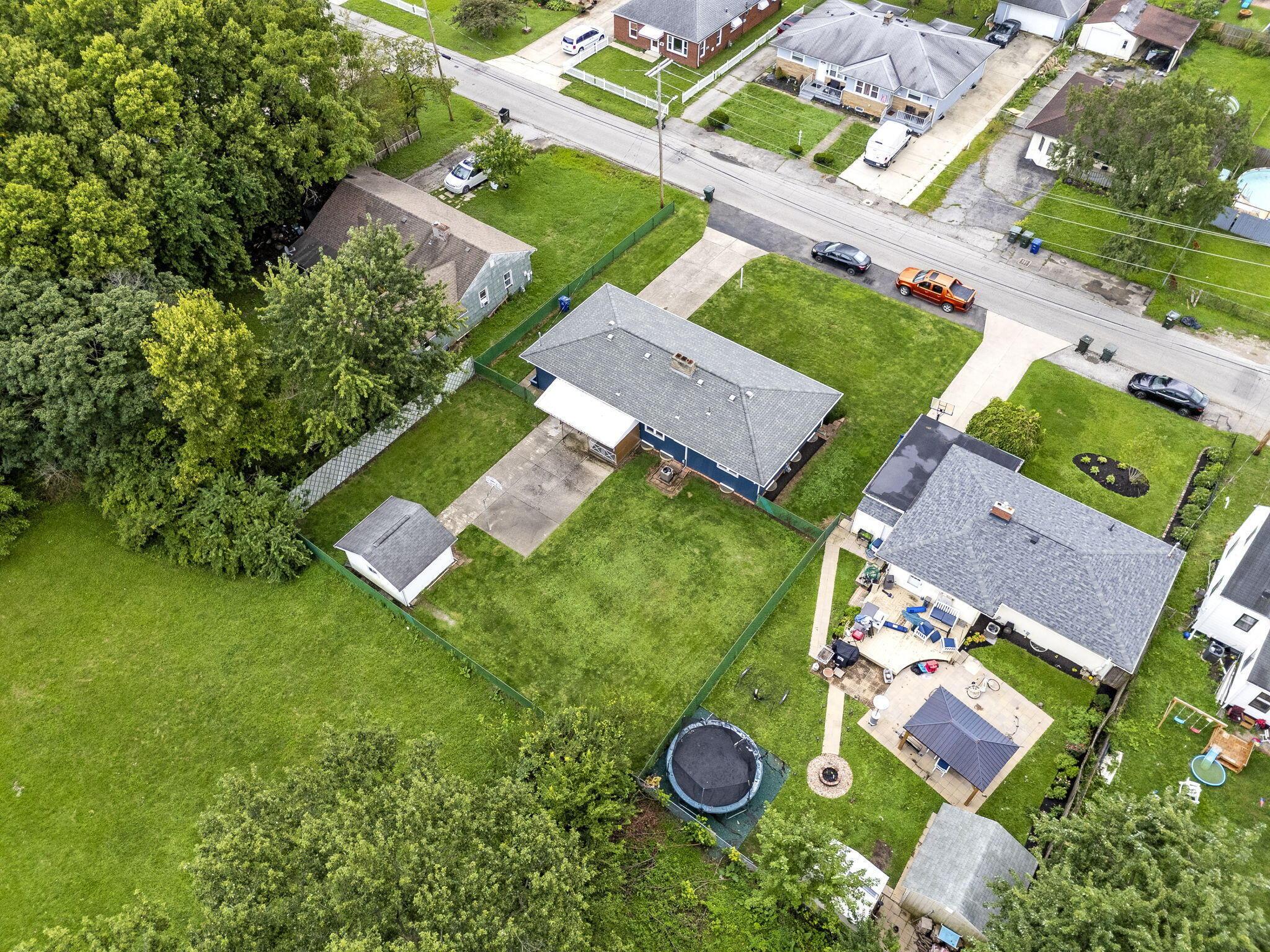 3496 Wicklow Road Columbus, OH 43204 - Photo 49 of 53 Expansive property with a blue-sided residence, a detached garage, and a shed