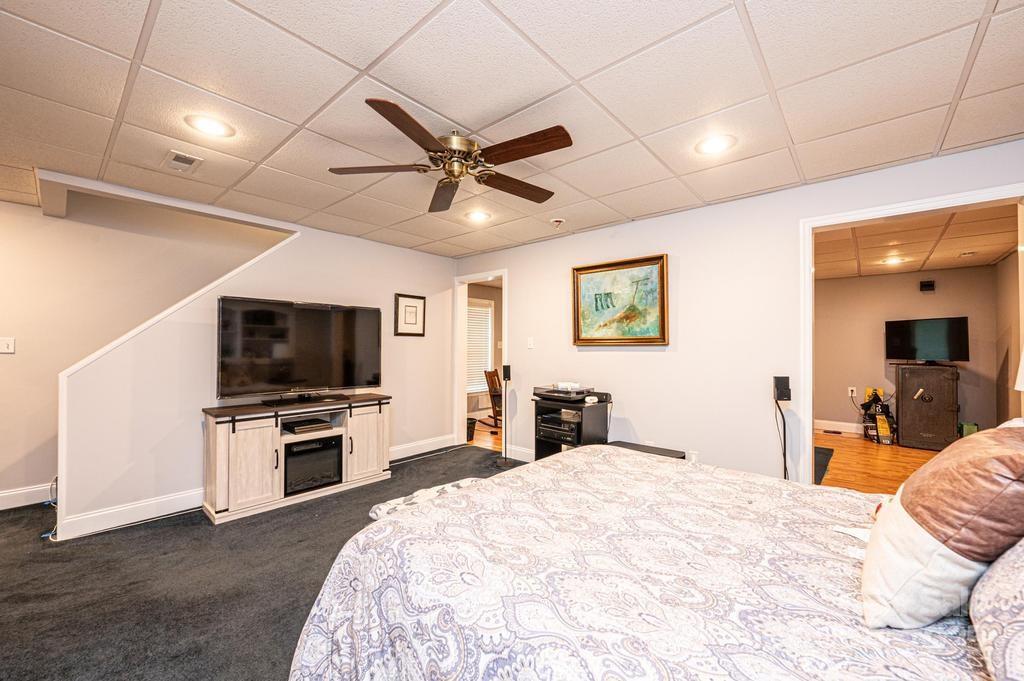 2594 Knoll Ridge Court Hickory, NC 28602 - Photo 27 of 43 a bedroom with a bed and a flat screen tv