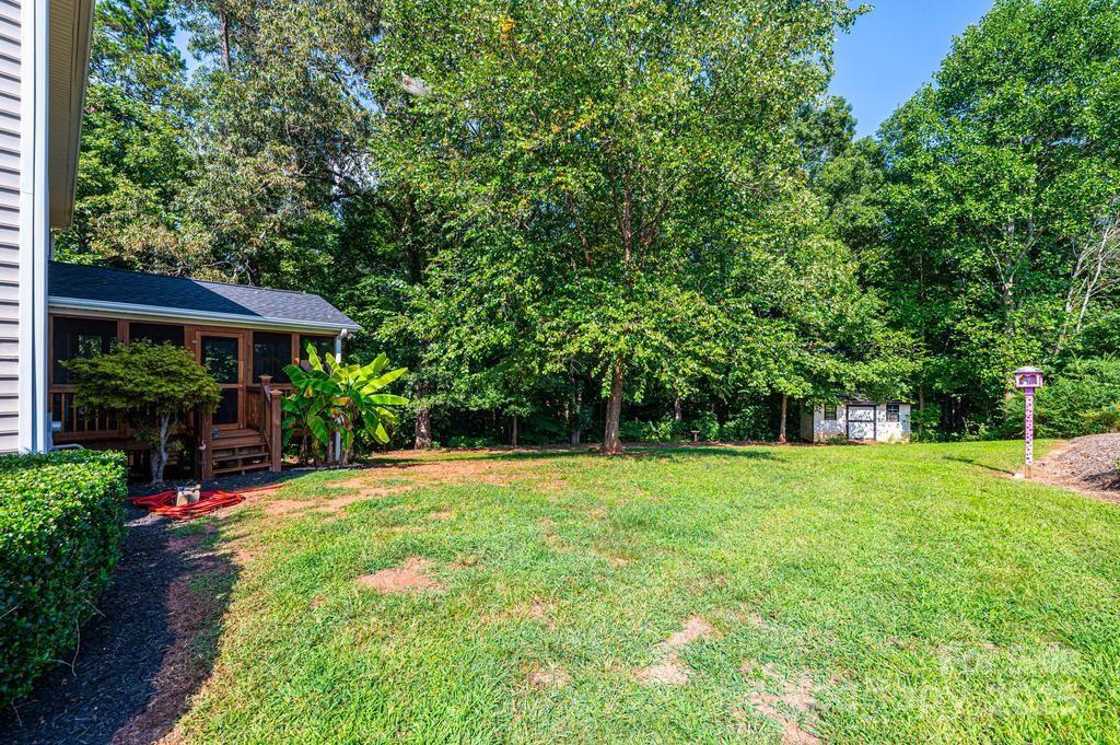 2594 Knoll Ridge Court Hickory, NC 28602 - Photo 39 of 43 a view of a big yard with plants and large trees