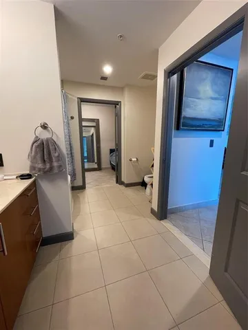 a bathroom with a sink double vanity and a mirror