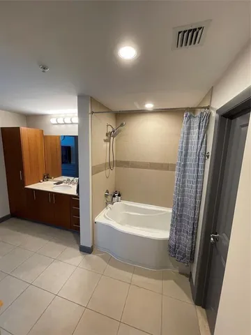 a bathroom with a sink double vanity and a mirror