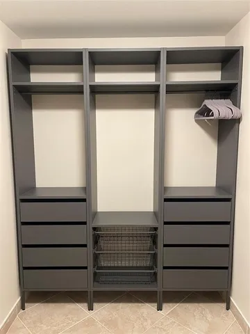 a view of livingroom with furniture and cars