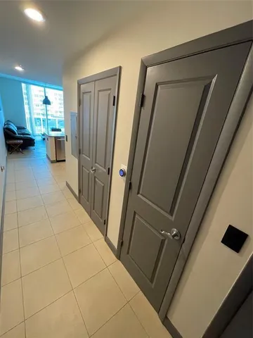 a view of hallway with furniture and a shower