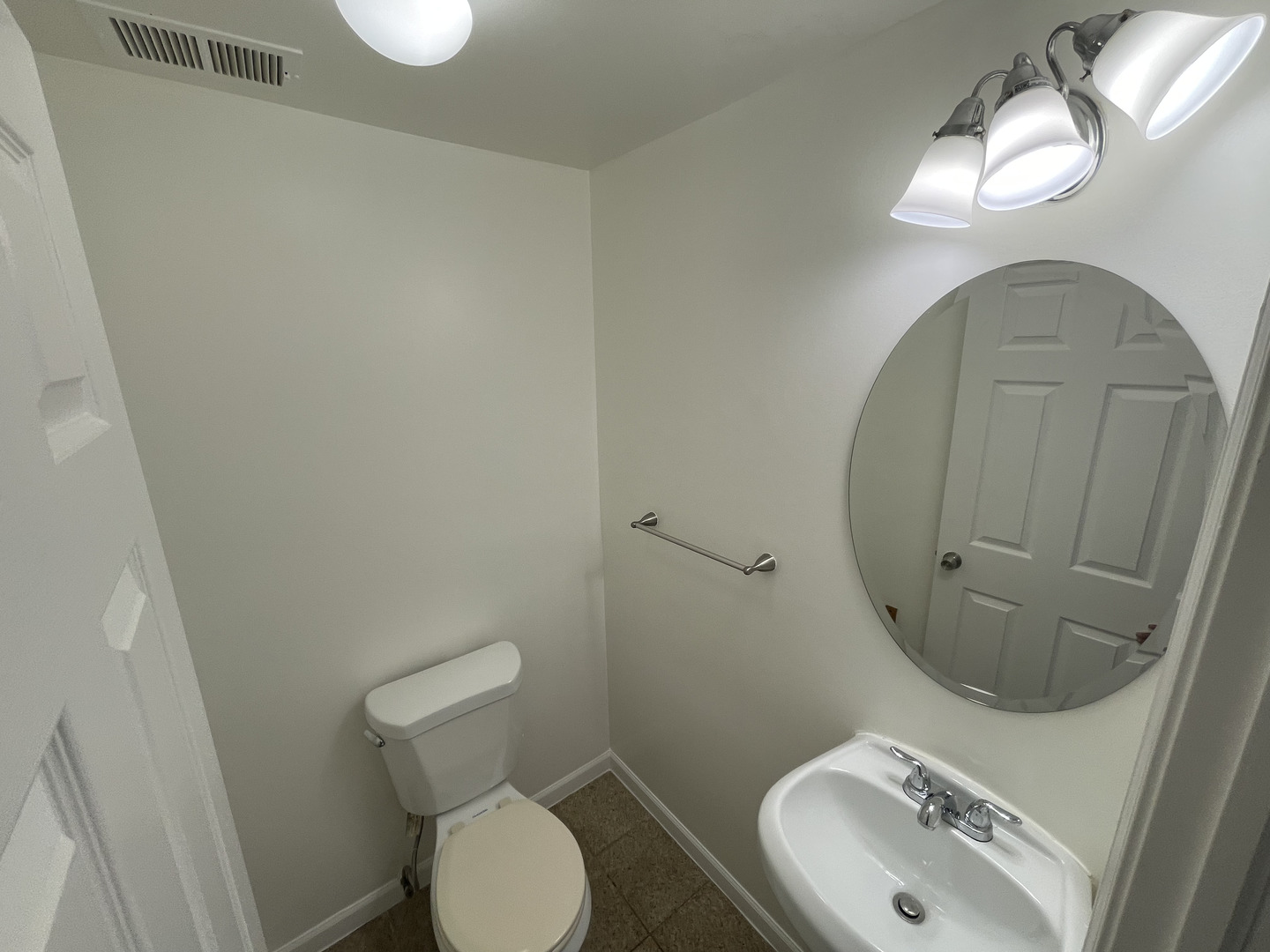649 East Marquette Road, Unit 4 Chicago, IL 60637 - Photo 11 of 19 a bathroom with a sink mirror and toilet