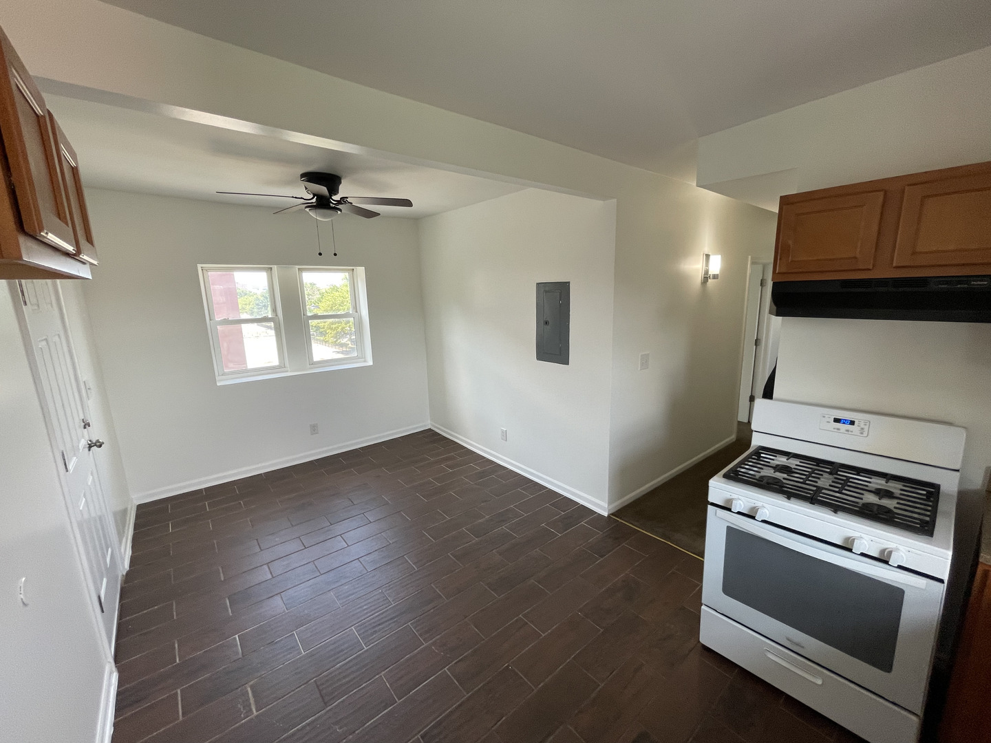 649 East Marquette Road, Unit 4 Chicago, IL 60637 - Photo 15 of 19 a view of kitchen and entryway with wooden floor