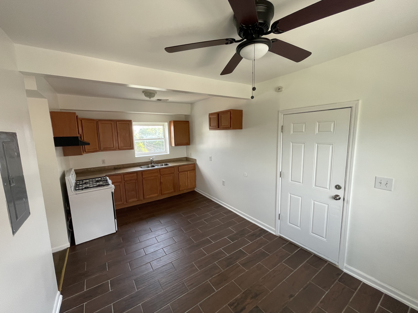 649 East Marquette Road, Unit 4 Chicago, IL 60637 - Photo 17 of 19 a view of a room with wooden floor and ceiling fan
