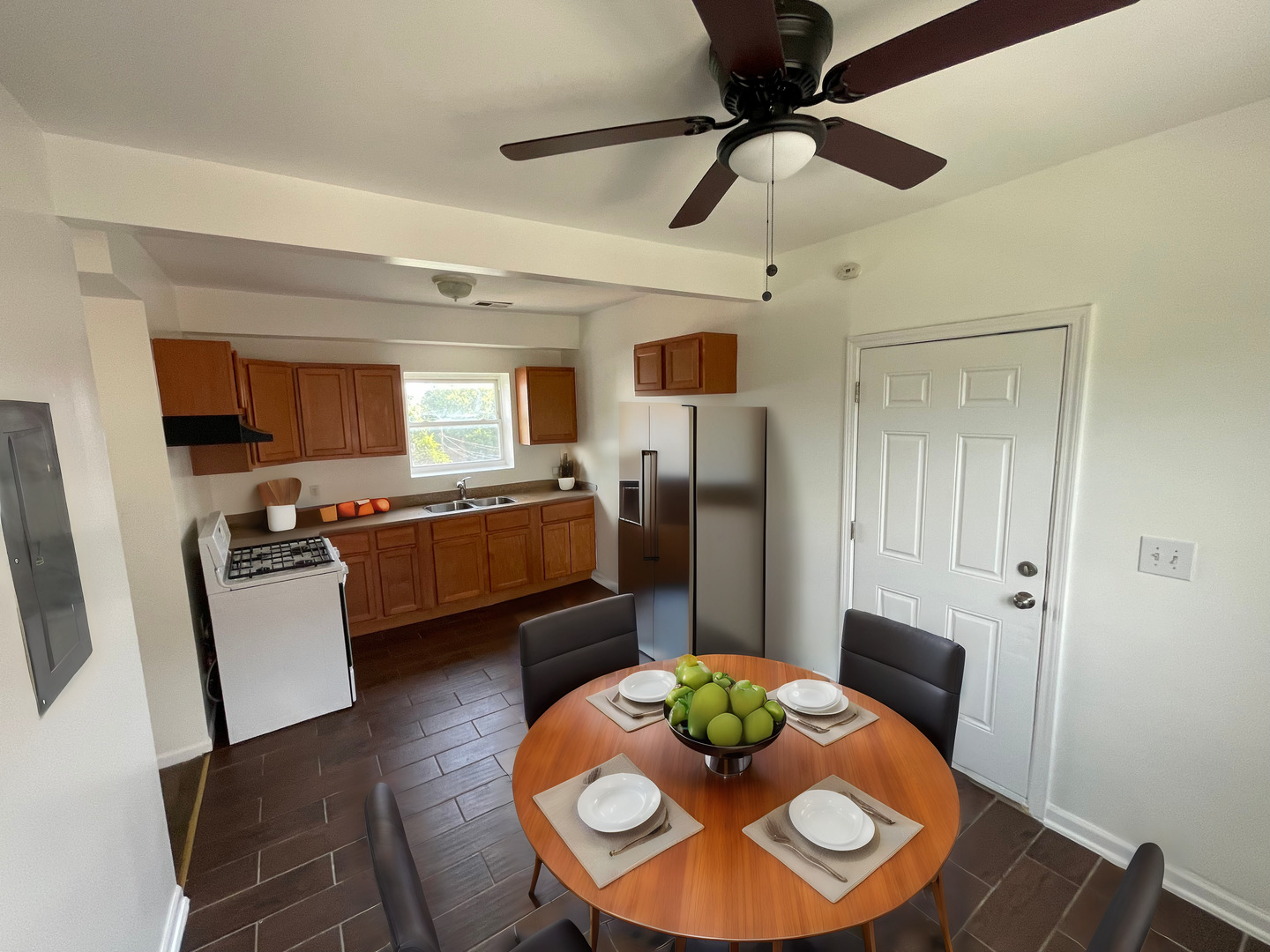 649 East Marquette Road, Unit 4 Chicago, IL 60637 - Photo 18 of 19 a kitchen with stainless steel appliances granite countertop a dining table and chairs