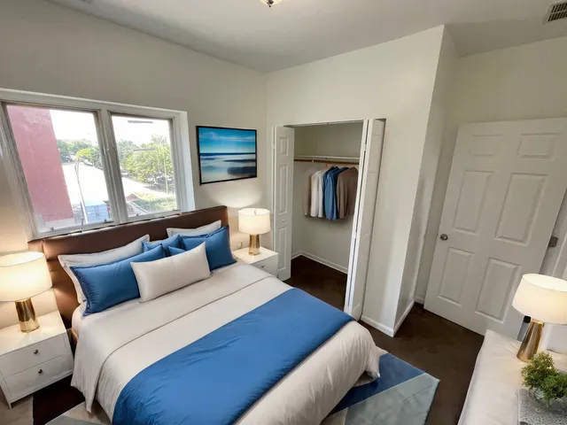 a bed room with a bed and a window