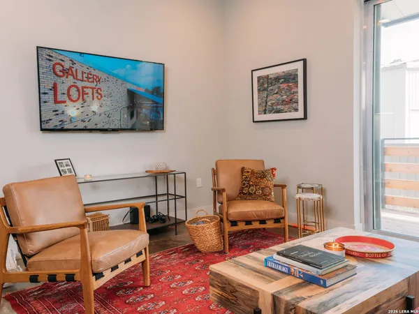 a bedroom with furniture and wooden floor