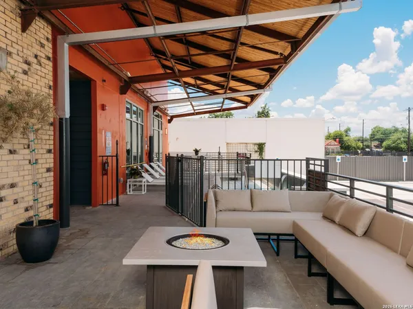 a view of a patio with couches and potted plants