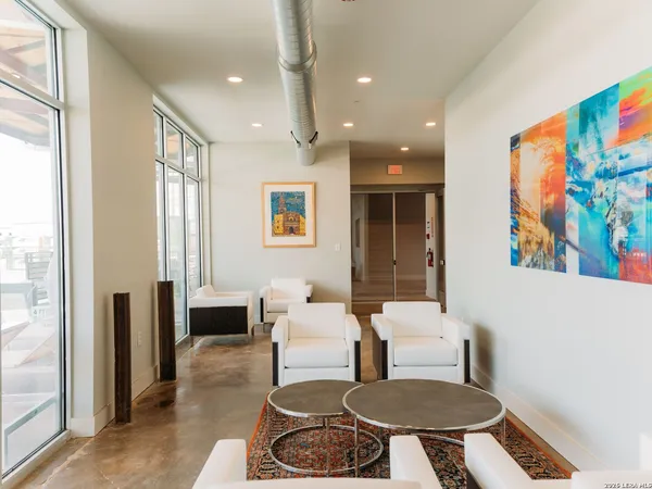 a living room with furniture and a table