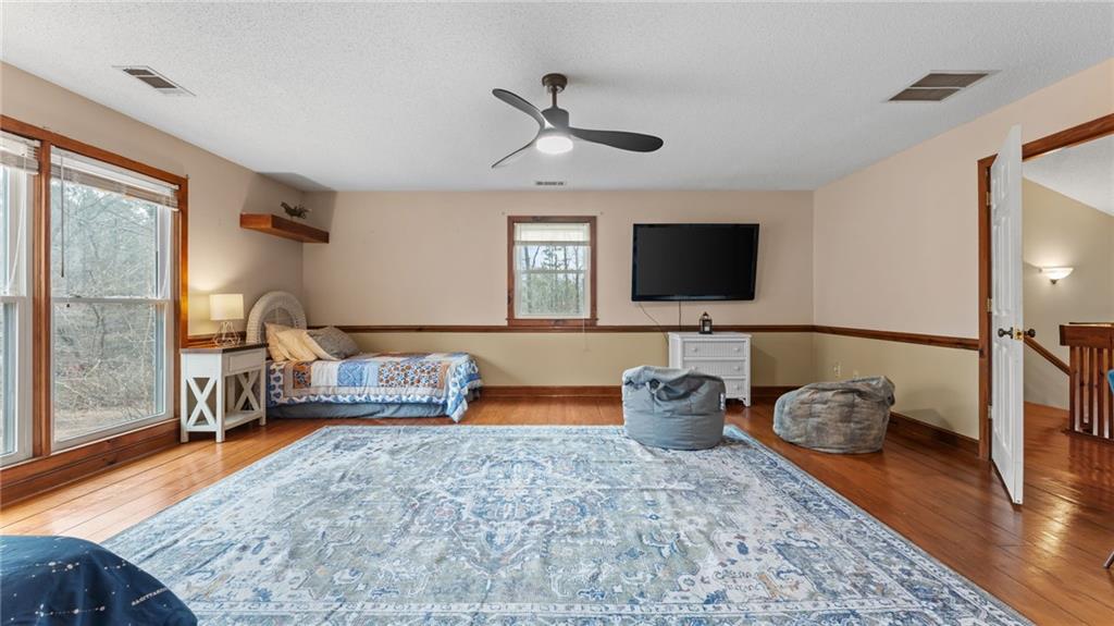 8315 Nicholson Road Cumming, GA 30028 - Photo 30 of 62 a living room with furniture and a flat screen tv