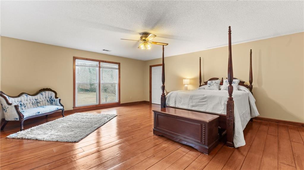 8315 Nicholson Road Cumming, GA 30028 - Photo 33 of 62 a living room with furniture and wooden floor