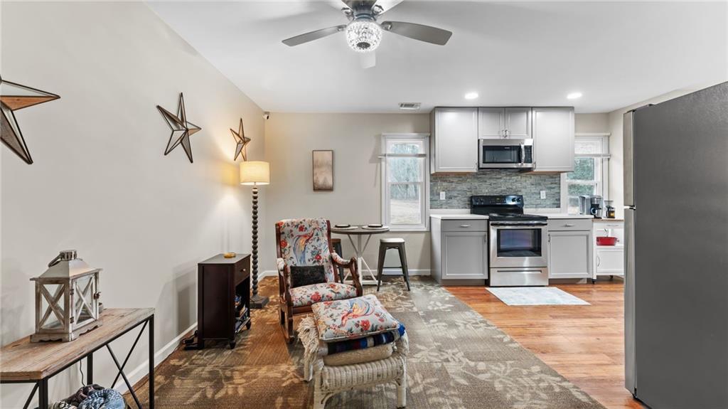 8315 Nicholson Road Cumming, GA 30028 - Photo 35 of 62 a living room with furniture and kitchen view