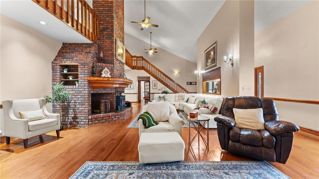 8315 Nicholson Road Cumming, GA 30028 - Photo 4 of 62 a living room with furniture and a fireplace