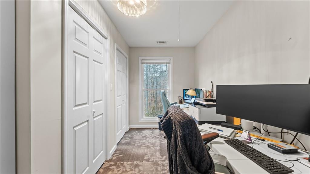 8315 Nicholson Road Cumming, GA 30028 - Photo 42 of 62 a bedroom with bed and a window