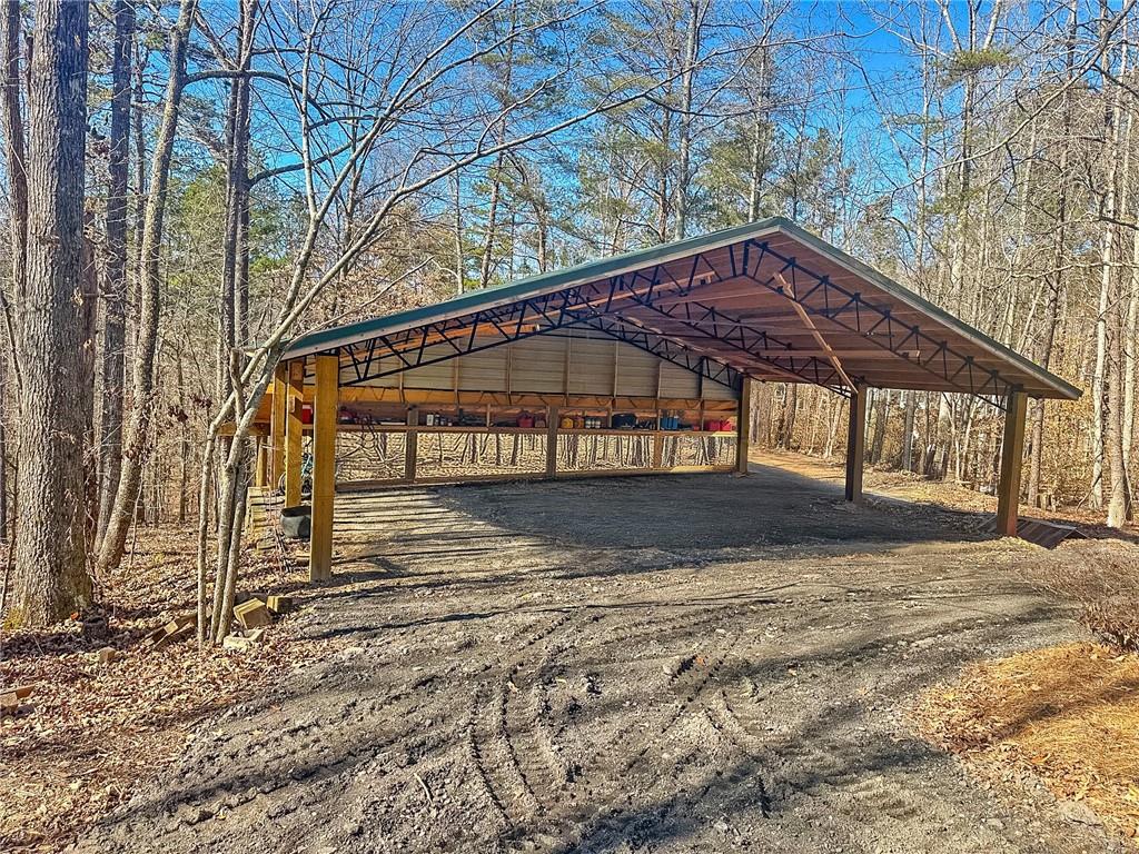 8315 Nicholson Road Cumming, GA 30028 - Photo 47 of 62 a view of a house with a yard