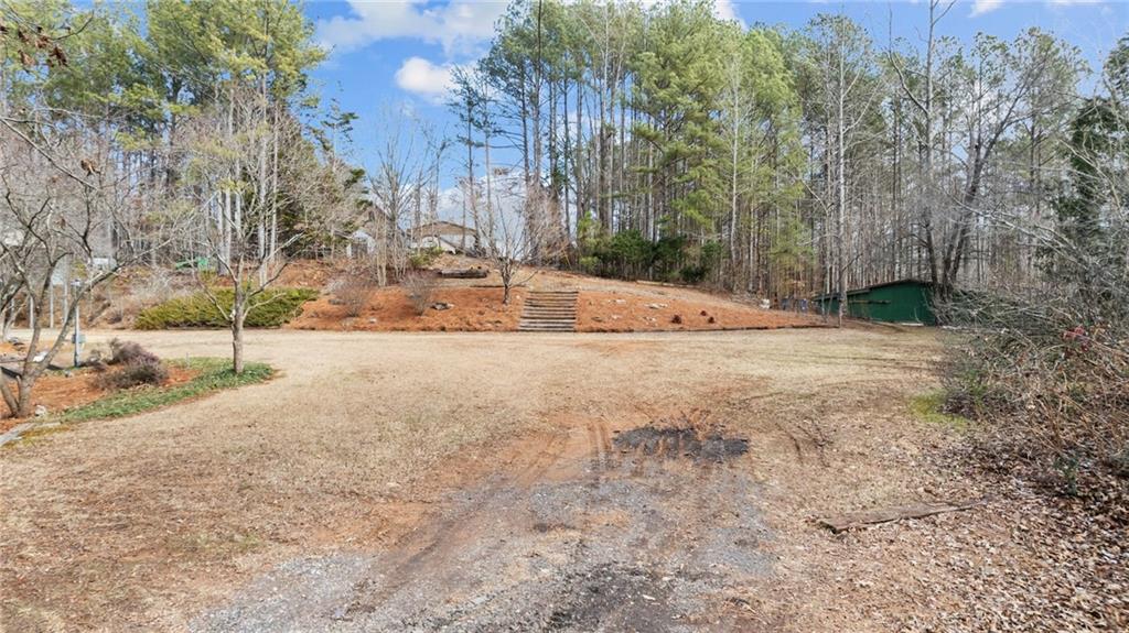 8315 Nicholson Road Cumming, GA 30028 - Photo 54 of 62 a view of empty space with trees