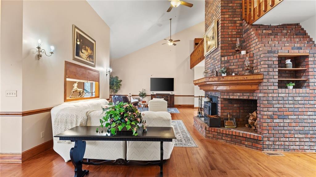 8315 Nicholson Road Cumming, GA 30028 - Photo 6 of 62 a living room with furniture and a fireplace