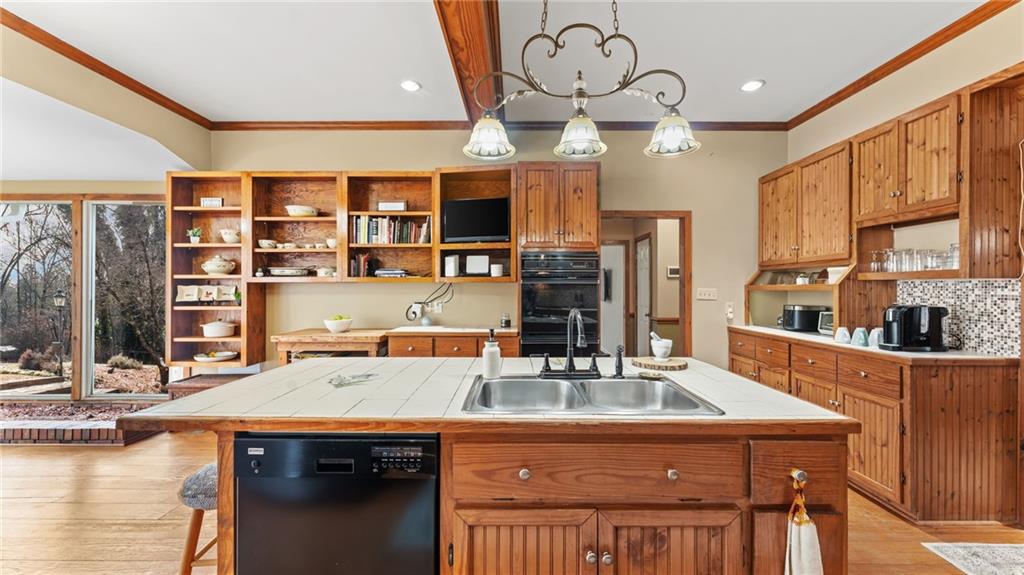 8315 Nicholson Road Cumming, GA 30028 - Photo 9 of 62 a kitchen with a table chairs and cabinets