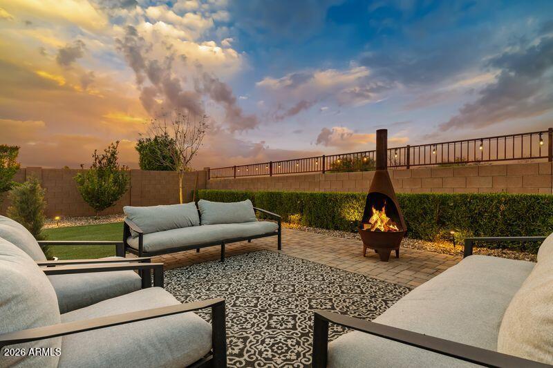 7871 South Stuart Avenue Gilbert, AZ 85298 - Photo 57 of 77 a view of swimming pool with a couches and potted plants