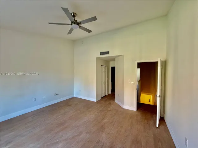 wooden floor in an empty room and a window