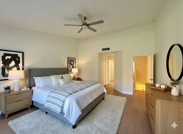 a bedroom with a bed and dresser