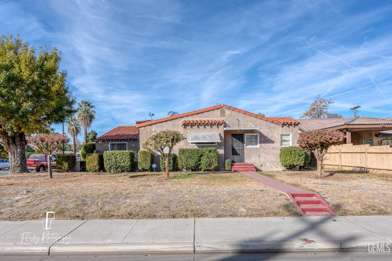 Undisclosed Address Bakersfield, CA 93304 - Photo 1 of 38 a front view of a house with a yard