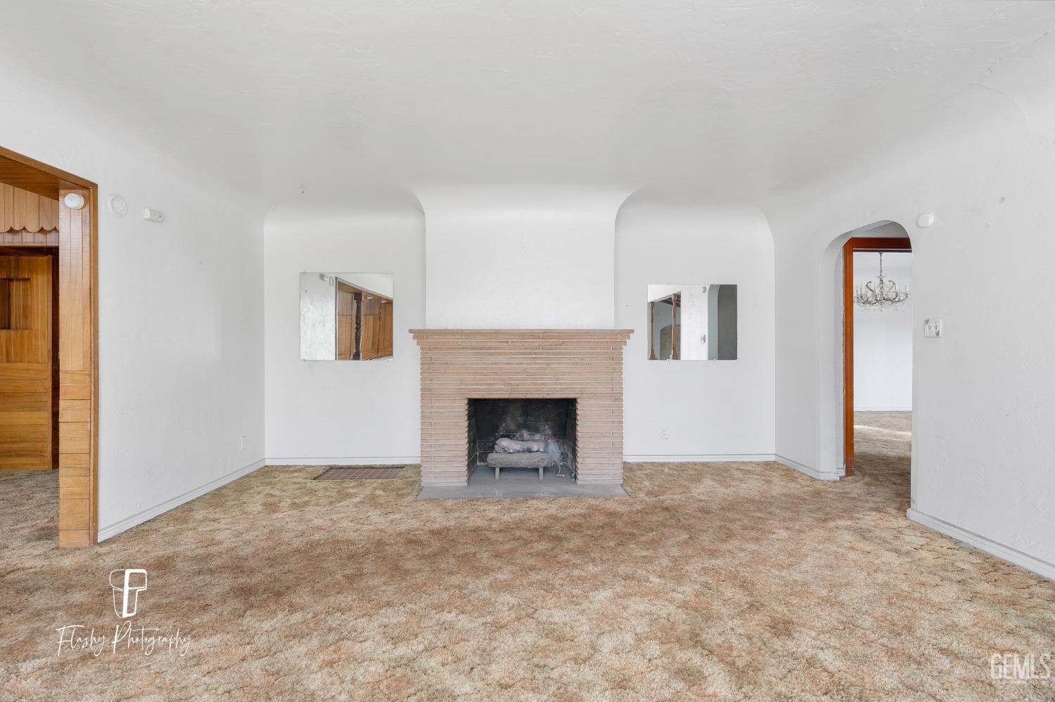 Undisclosed Address Bakersfield, CA 93304 - Photo 12 of 38 a view of empty room with a fireplace