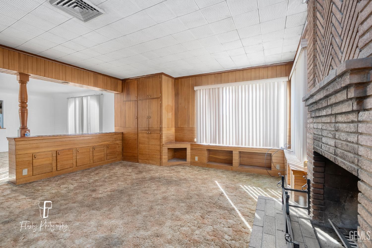 Undisclosed Address Bakersfield, CA 93304 - Photo 14 of 38 a spacious bedroom with a large bed and a fireplace