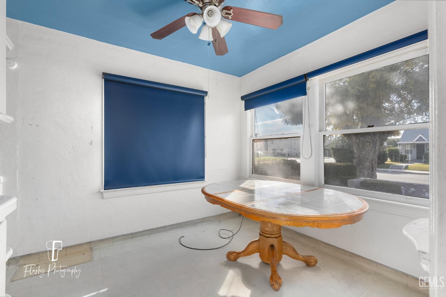Undisclosed Address Bakersfield, CA 93304 - Photo 21 of 38 a dining room with chandelier fan and wooden floor