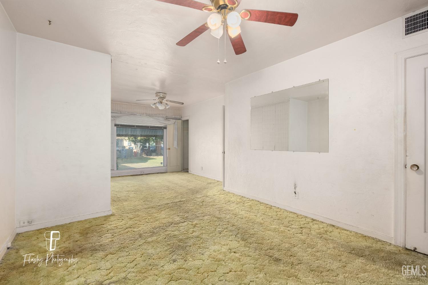 Undisclosed Address Bakersfield, CA 93304 - Photo 24 of 38 a view of an empty room and chandelier fan